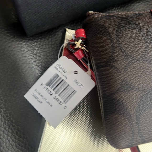 Coach signature wristlet. NWT and gift box included. - Picture 2 of 7